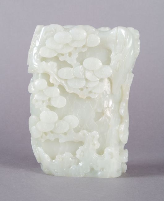 A well-documented provenance adds value to this pale jade vase dating to the long reign of the Qianlong Emperor in the 18th century. Carved with trees and rocks in relief, the object sold for $96,400 in a February 2009 Leslie Hindman sale. Courtesy Leslie Hindman Auctioneers